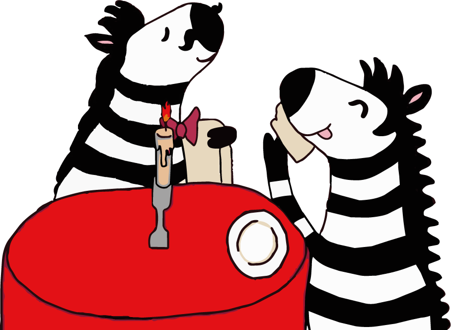 Two zebras enjoying dinner together
